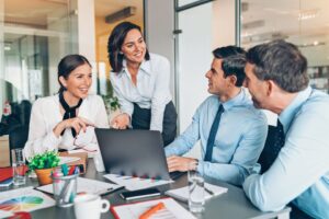 Woman leader practicing the head, heart hands model