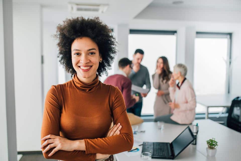 Woman leader who has learned to stop caring what other people think at work following The New Standard's leadership training.