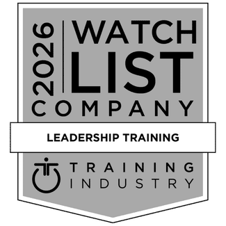 Award badge showing The New Standard named 2026 leadership training company to watch by Training Industry